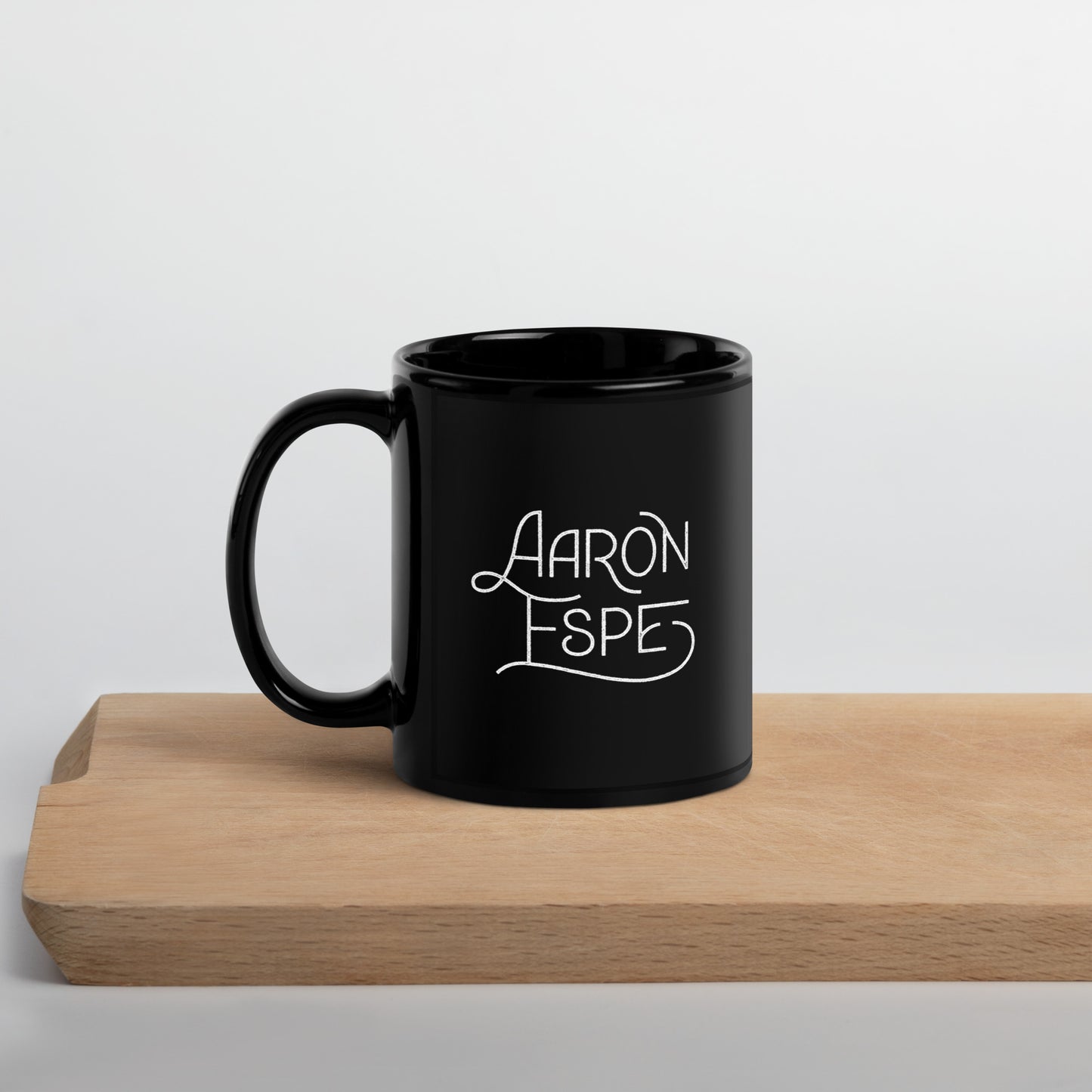 Black Glossy Mug Aaron Espe Logo